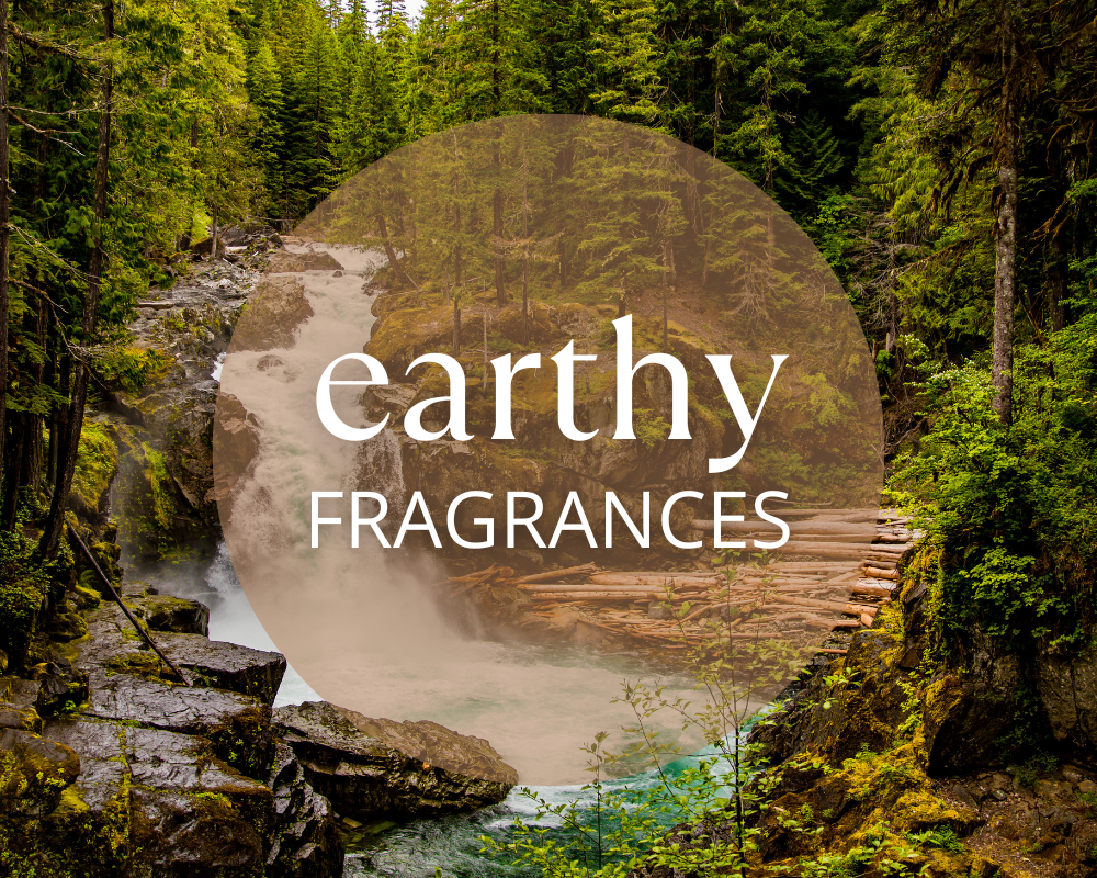 a woodland forest with a waterfall with the words earthy fragrances