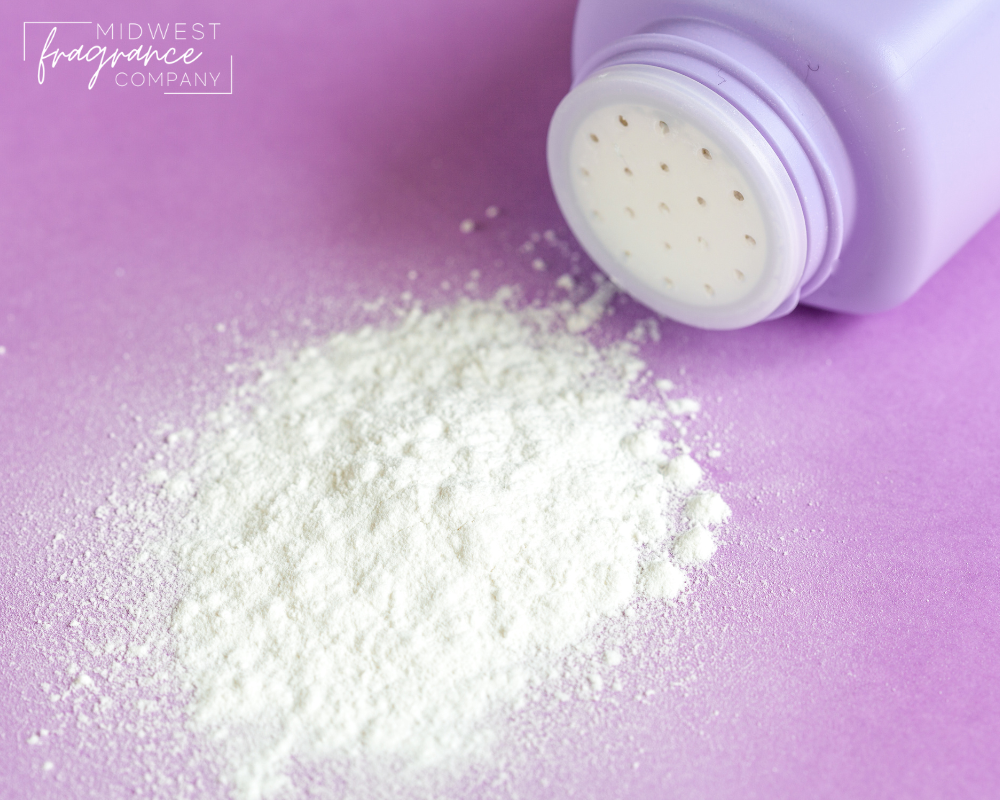 White baby powder spilled from a shaker jar onto a light pink surface.