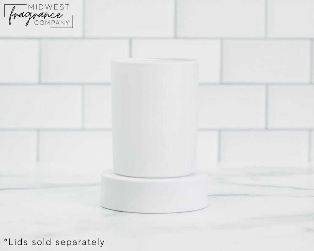 Straight sided, 11 oz. matte white glass tumbler used as a vessel for candles