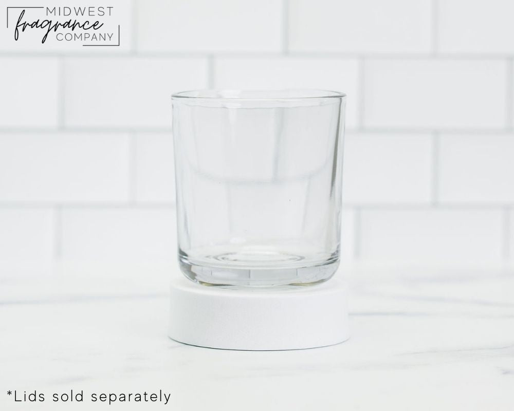 Straight sided, 17 oz. clear glass tumbler used as a vessel for candles