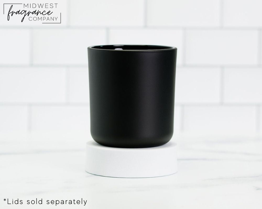 Straight sided, 17 oz. matte black glass tumbler used as a vessel for candles