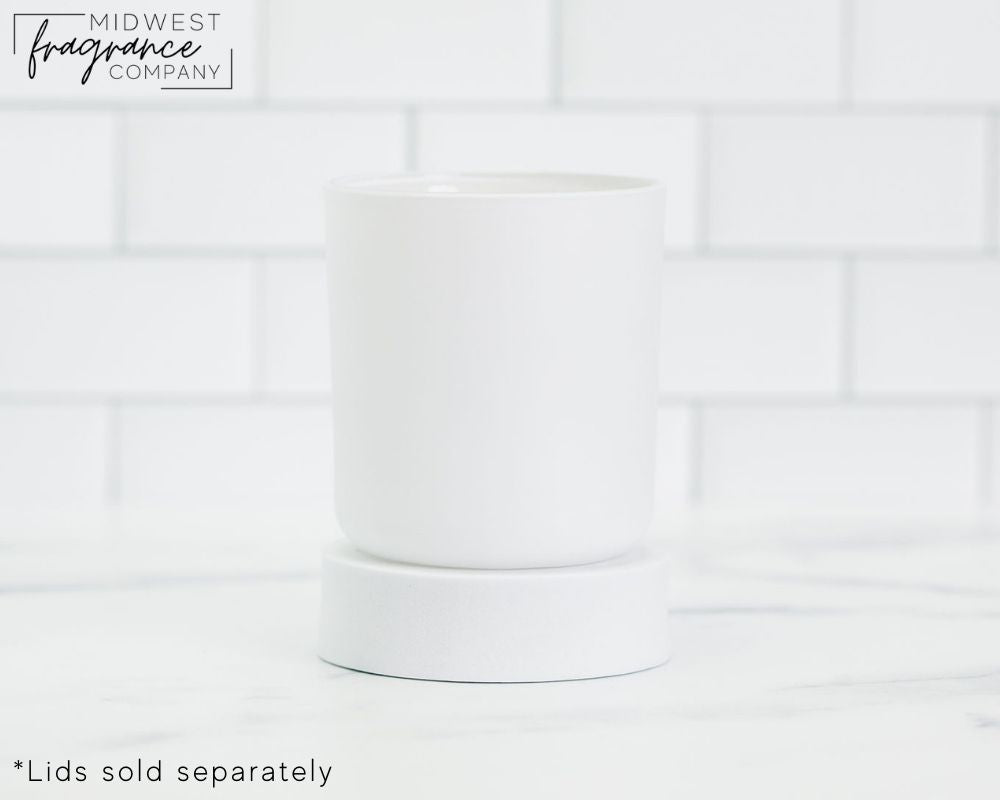 Straight sided, 17 oz. matte white glass tumbler used as a vessel for candles