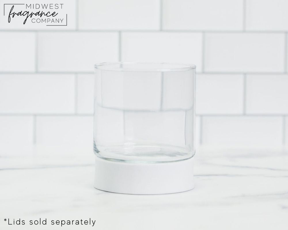 Straight sided, 8.8 oz. clear glass tumbler used as a vessel for 3-wick candles