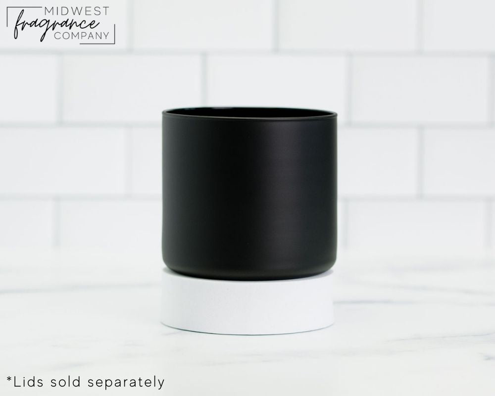 Straight sided, 8.8 oz. matte black glass tumbler used as a vessel for 3-wick candles