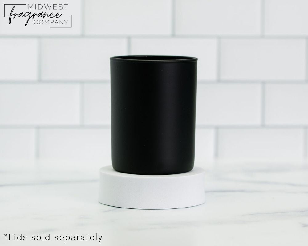 Straight sided, 11 oz. matte black glass tumbler used as a vessel for candles